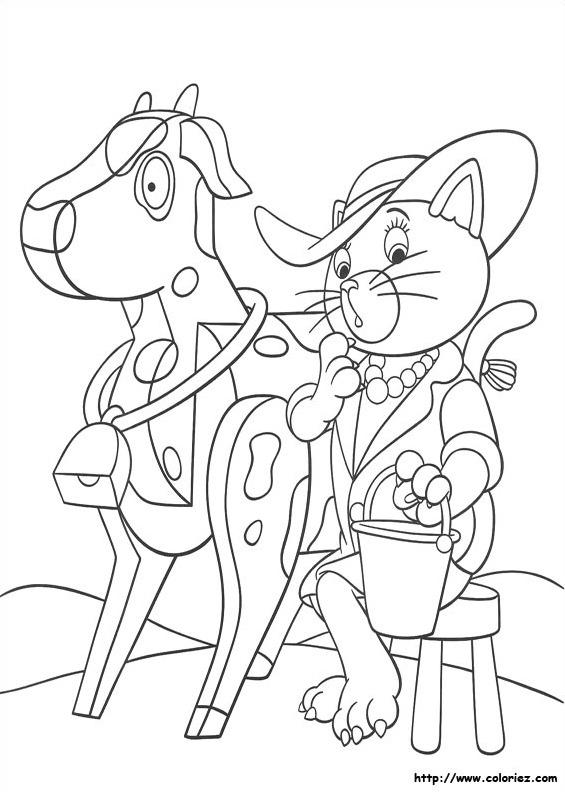 Mlle Chatounette trait une vache