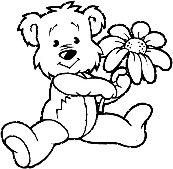 Un ourson joue avec une fleur